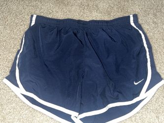 navy blue Nike running shorts  - CL
