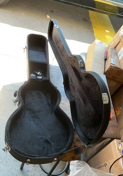 Acoustic or electric guitar case smaller size.