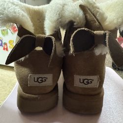  UGG Mini Bailey Bow II boots in the chestnut color