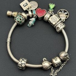 Jewelry Pandora 925 sterling silver gold tone 6.75” charm bracelet with 10 charms