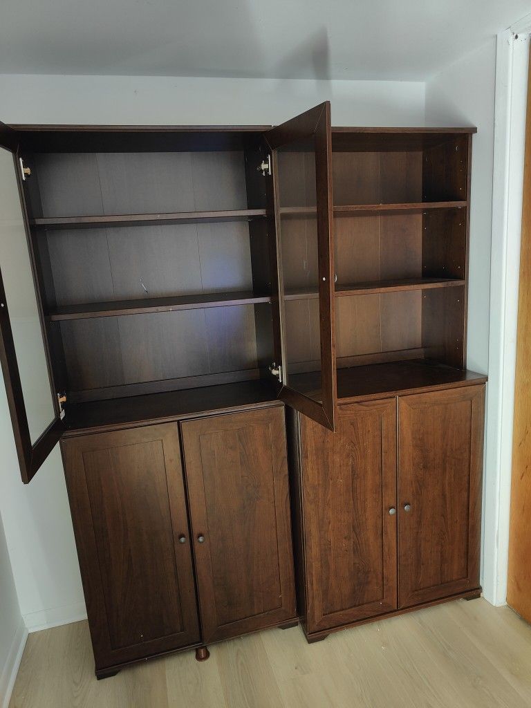 Three IKEA Billy cabinets