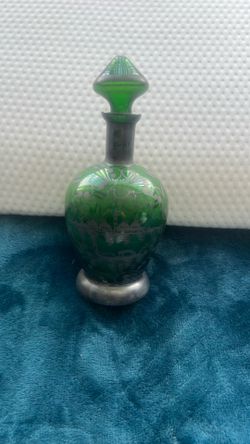 Art Nouveau green glass decanter with silver overlay and stopper.