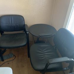2 Black Chairs With Round Table