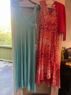 Two dresses, blue one NY and Co, size 6 brand new tag on it, peach only worn, size 6, Calvin Klein, worn once. 25 for both