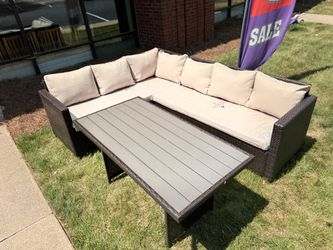 Dark Brown PE Wicker Outdoor Sectional Sofa With Beige Cushions And Outdoor Table