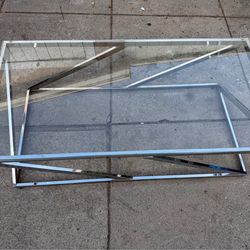 Glass table in excellent condition  not heavy  47” wide 2 feet side  16” high