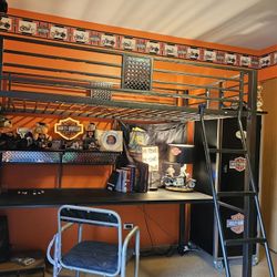 Black Metal loft Twin Bed. 
Includes a built-in desk,  Chair, and ladder. 
