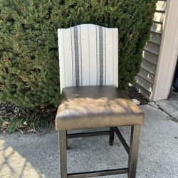Chair Is Brown Leather With Cream, Grey & Black Stripes. Upholstered Barstool
