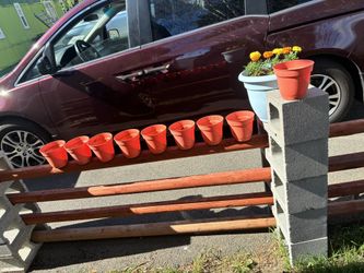$20 for all 9 small orangish tan plastic flower pots/planters. I have bigger pots for my flowers this year-  Must pick up at my house about a half mil