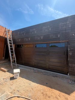 Brown Raised Panel Garage Door with Windows