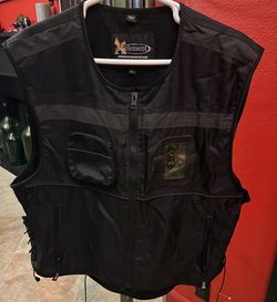Xelement riding vest. Fits like a 3x. Black. Never worn