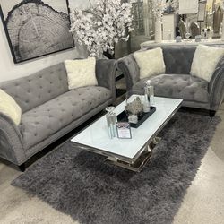 Used still in good condition grey charcoal couches white pillows & table