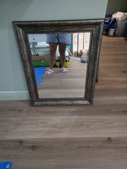 Gray frame mirror with beveled glass 28"h x 34"l see description
