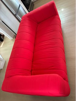 bright red loveseat couch