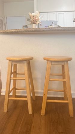 two wooden stools