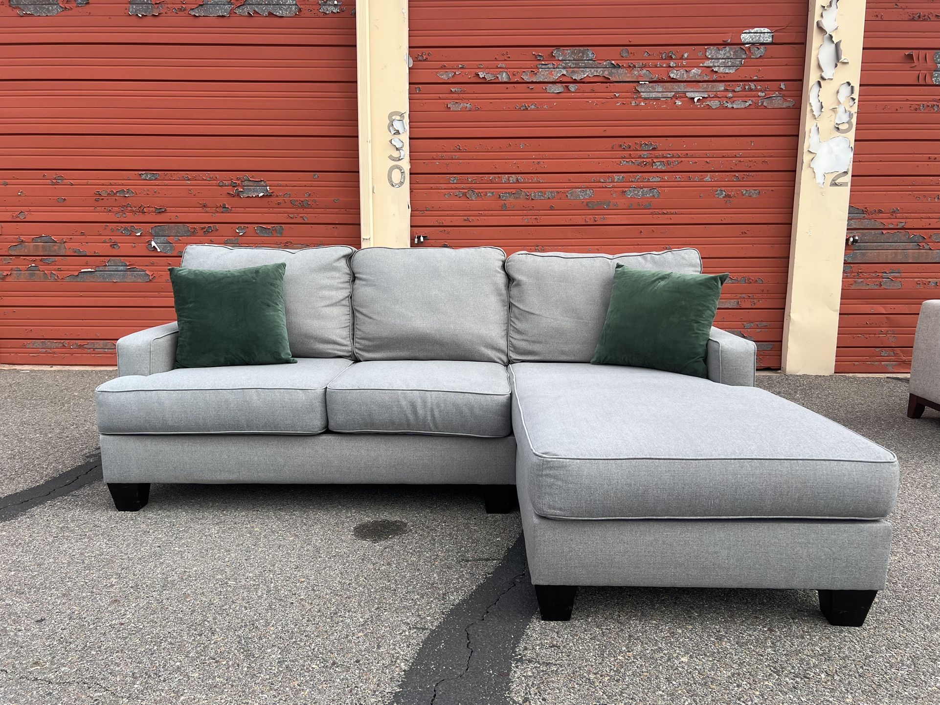 Ashley’s Gray Sectional Sofa Couch with right facing chaise