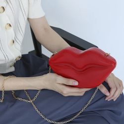 Red lips clutch bag with gold chain strap