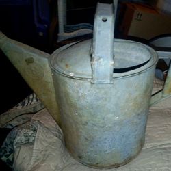 Nice vintage farmhouse galvanized metal watering can. 9 in tall 8 in wide
