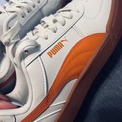 White & Orange Puma’s Size 8.5 Mens , 10 Womans