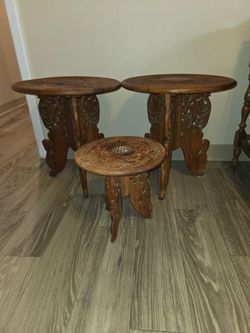 Three carved rosewood tables