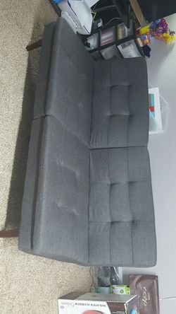 Grey sleeper sofa with coffee table used only 2 months by a single person student. PRICE NEGOTIABLE.