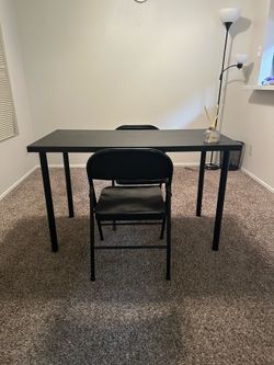 Black desk with 2 folding chairs