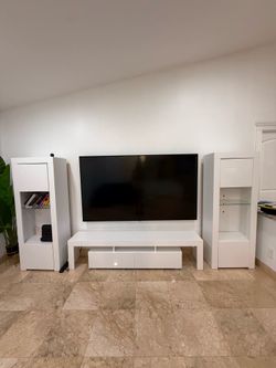 Great condition like new white TV console with a drawer and open shelves. Two matching white display cabinets  With NO the TV   Bottom one size w80” D