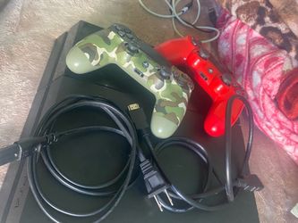 PS4 Console with Two Controllers and Cables