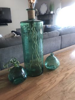 3 blue/green glass vases.