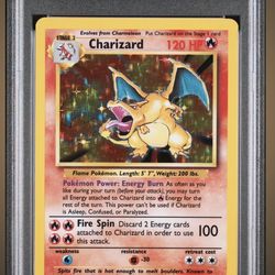 PSA 7 NM: Charizard Holo 1999