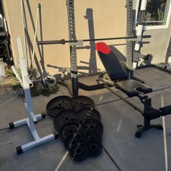 Heavy duty bench press/squat rack with 7ft bar plus 240lbs of Olympic weights and weight tree