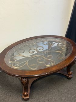 Oval Glass Top Coffee Table with Scrollwork