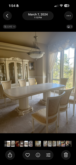 Dining room table seats eight with matching hutch