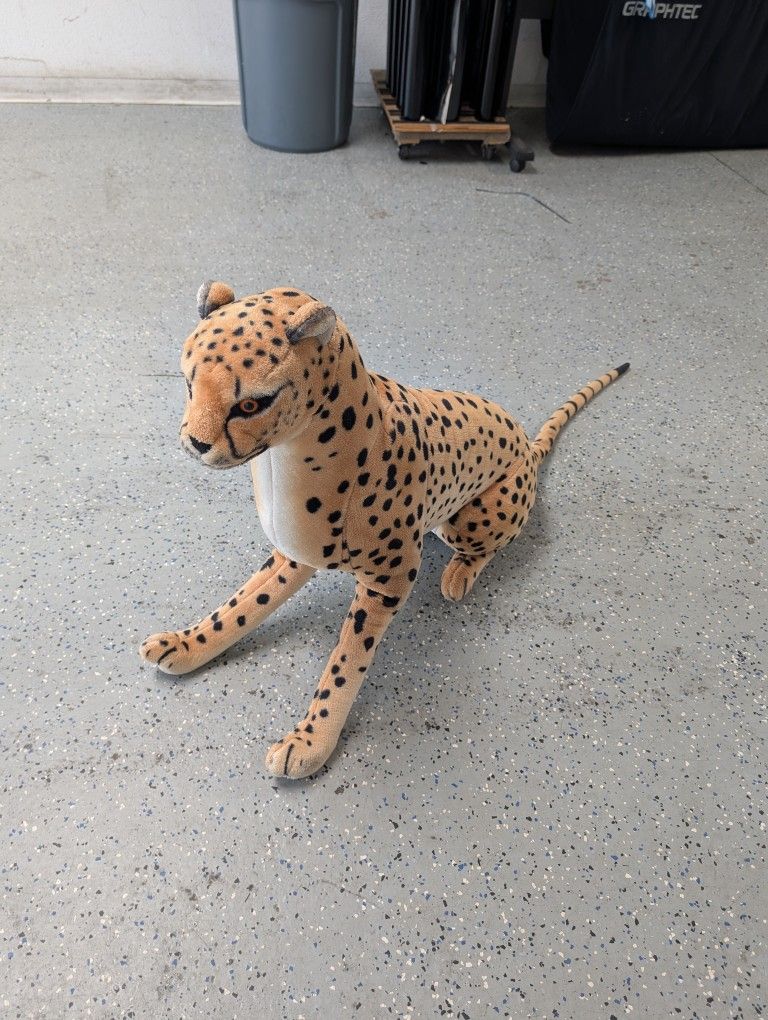 Cheetah And Huge Teddy Bear