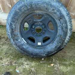 Old Spare Chevy 6 Lug Wheel