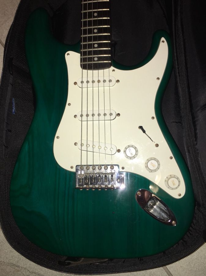 Austin Strat style electric guitar. OBO. See thru green wood grain is beautiful