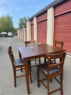 Wooden square high table and four chairs