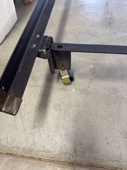 Queen bed rail with wheels dissembled