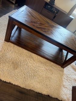 Rustic wood lift top coffee table from living spaces.