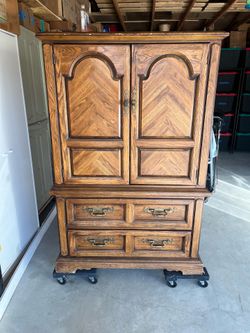 Armoire dark wood three drawer