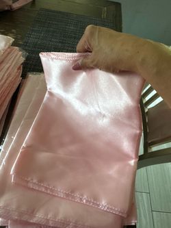 Blush pink napkins and satin table runners