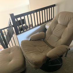 Tan leather chair with ottoman. Reclines when you lean back. 