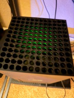 Xbox x 1tb disc drive and a curved Acer monitor