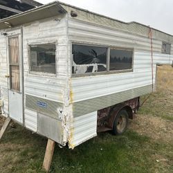 Camper Sitting In a Truck Bed Trailer