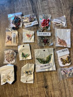 Brooches new with tags