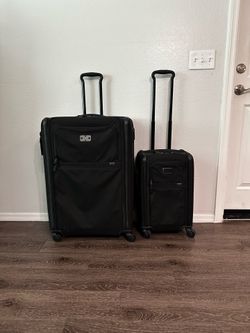 2 Tumi suite cases