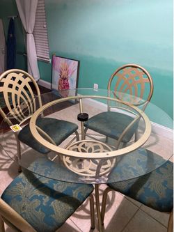 Round glass table with 4 chairs