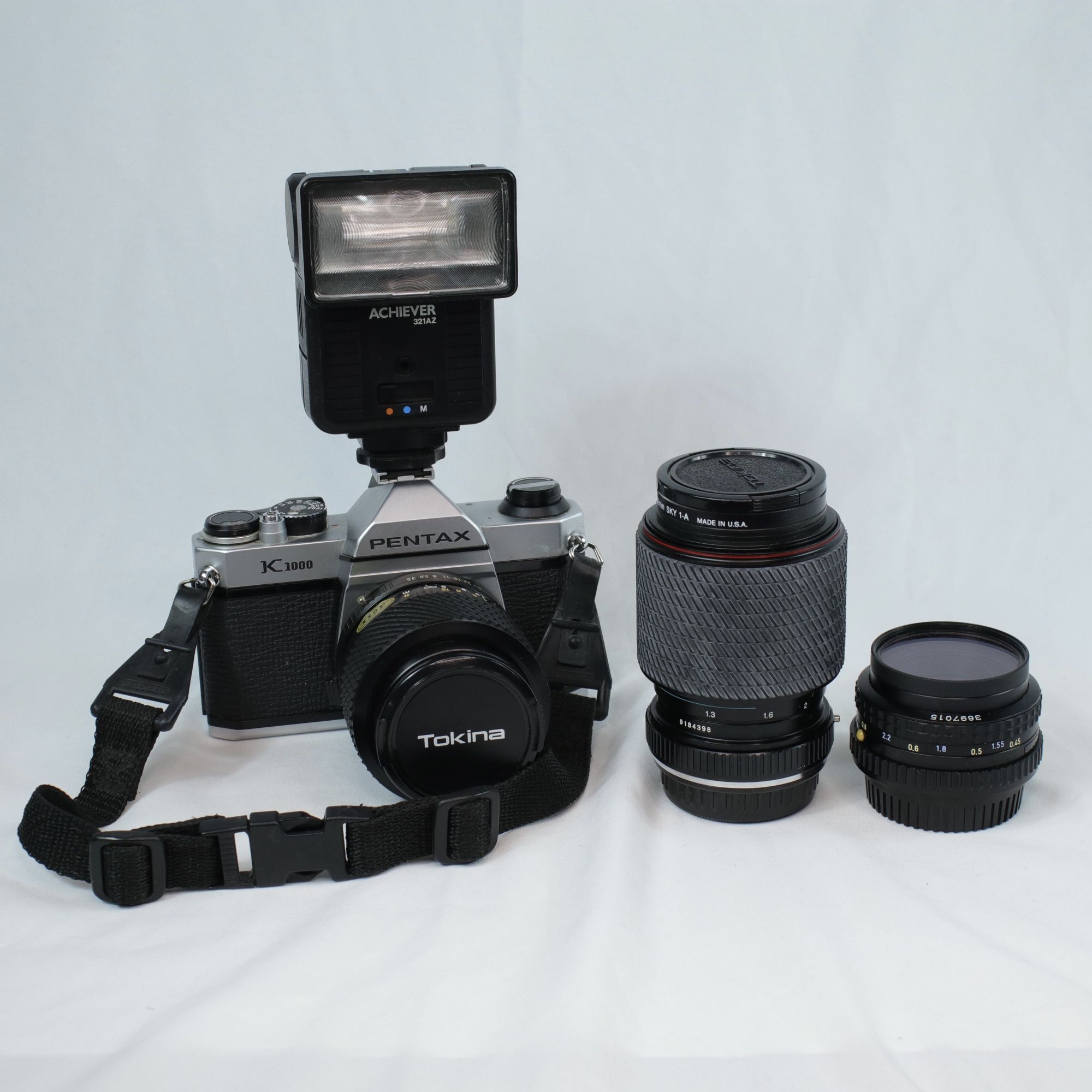 Vintage Pentax K1000 Film Camera with Extra Lenses + Camera Flash and Carrying Bag