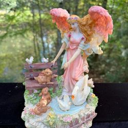 Vintage Collectable Angel Musical Figurine  Plays Angels We Have Heard On High". 
