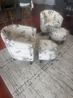 Two Chairs and ottomans